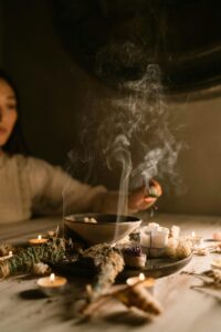 A serene atmosphere with candles, dried herbs, and soft lighting, ideal for meditation themes.